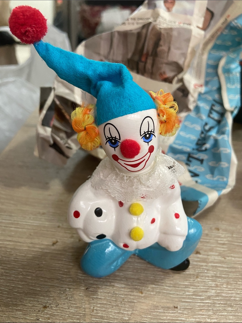 Vintage Blue and White Ceramic Clown Figurine with Yellow Accents